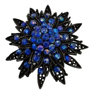 Vintage Black Metal Flower Brooch with Blue Aurora Borealis Rhinestones – 2”‎